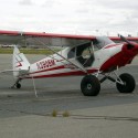 super cub piper custom restoration white and red plane parked