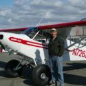 aviation repair happy customer by white and red plane